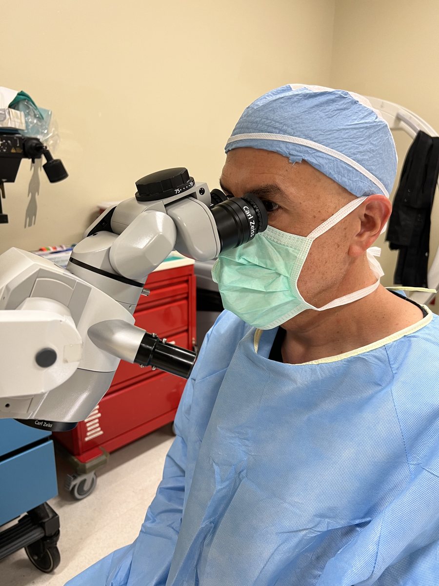 Glaucoma surgeon at Inland Glaucoma Center performing microsurgery through an operating microscope in Upland, California